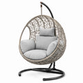 Chaise suspendue en rotin avec coussins et support en acier